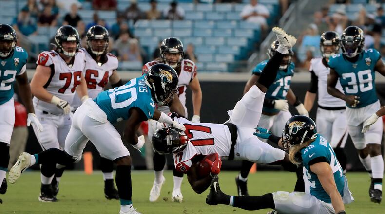 JACKSONVILLE, FLORIDA - AUGUST 29: Olamide Zaccheaus #17 of the Atlanta Falcons is tackled by Tae Hayes #30 of the Jacksonville Jaguars during a preseason game at TIAA Bank Field on August 29, 2019 in Jacksonville, Florida. (Photo by Sam Greenwood/Getty Images)