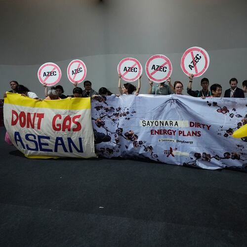 Activists, and one dressed in a Pikachu costume, protest Japan's financing of coal and natural gas projects during the COP30 U.N. Climate Summit, Friday, Nov. 14, 2025, in Belem, Brazil. (AP Photo/Fernando Llano)