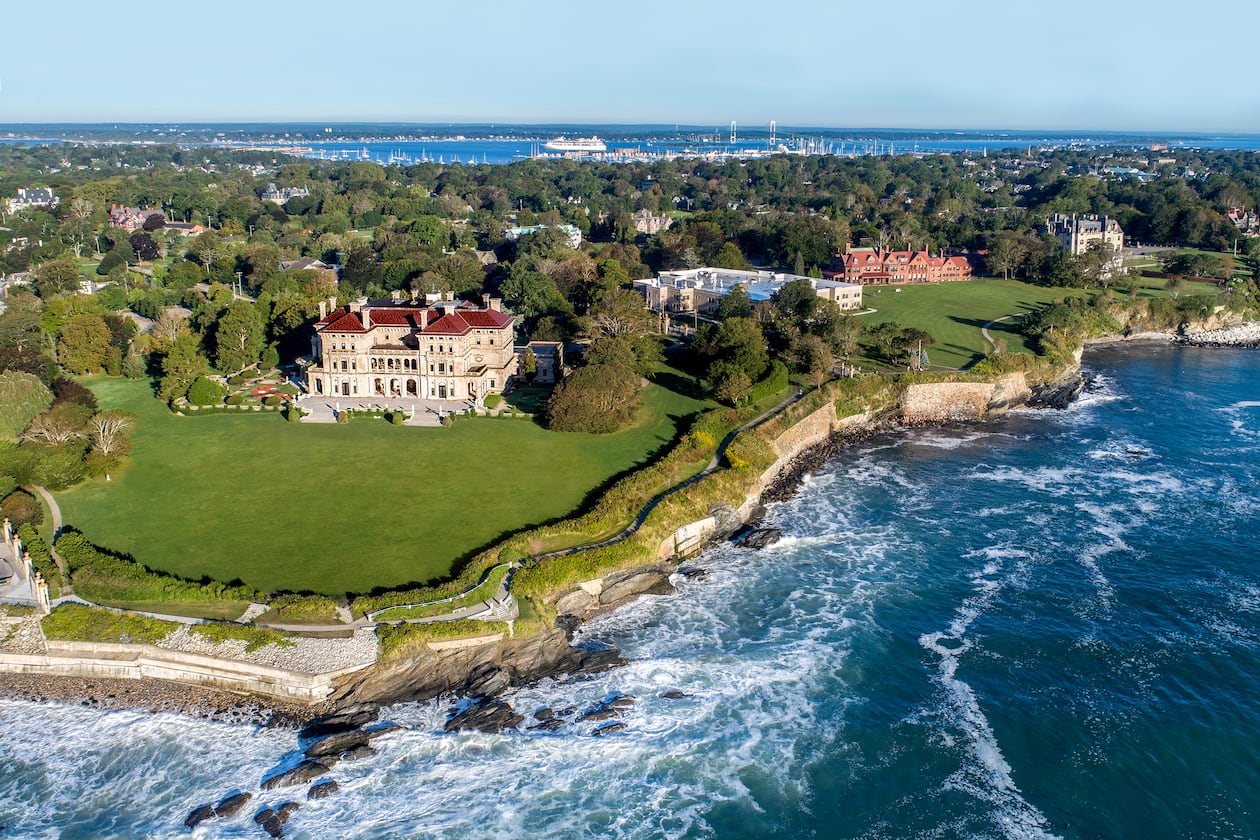 A stretch of Newport’s scenic Cliff Walk passes alongside The Breakers, the Vanderbilt family’s grand Gilded Age mansion in Newport, Rhode Island. (Courtesy of Discover Newport)