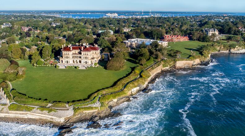 A stretch of Newport’s scenic Cliff Walk passes alongside The Breakers, the Vanderbilt family’s grand Gilded Age mansion in Newport, Rhode Island. (Courtesy of Discover Newport)