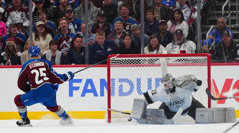 Colorado Avalanche right wing Logan O'Connor (25) scores against Los Angeles Kings goaltender Anton Forsberg (31) during the third period of Game 1 in the first round of the NHL hockey Stanley Cup playoffs, Sunday, April 19, 2026, in Denver. (AP Photo Jack Dempsey)