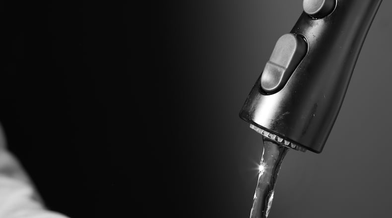 A glass of water from the tap, in New York, May 2023. The Biden administration announced Tuesday federal grants to reduce lead in schools and child care facilities. (Thea Traff/The New York Times)