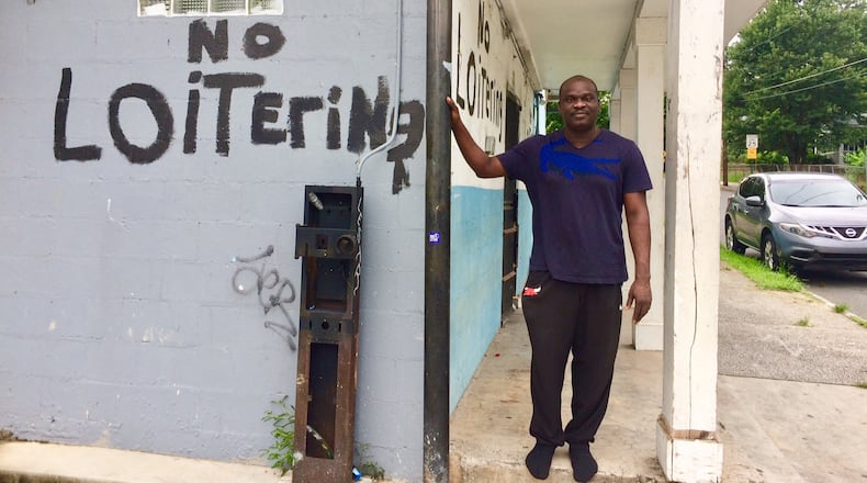 Toju Oris stands outside the store he has owned for 11 years in the English Avenue neighborhood. "Change here is inevitable," he said. Photo by Bill Torpy