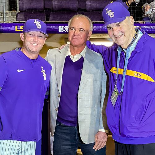 FILE - LSU head coach Jay Johnson, left, smiles with retired head coach Paul Mainieri, and head coach Skip Bertman before an NCAA baseball game against Maine on Feb. 18, 2022, in Baton Rouge, (AP Photo/Matthew Hinton, File)