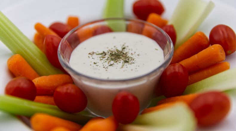 Ranch dressing is served with raw vegetables in Phoenix, Monday, April 13, 2026. (AP Photo/Dario Lopez-Mills)