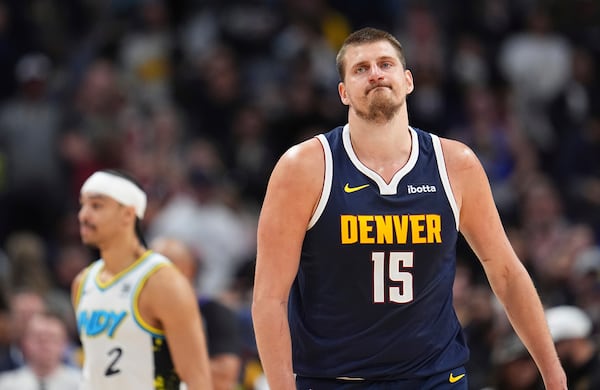 Denver Nuggets center Nikola Jokic reacts after missing last-second, 3-point basket- attempt in the second half of an NBA basketball game against the Indiana Pacers, Sunday, April 6, 2025, in Denver. (AP Photo/David Zalubowski)