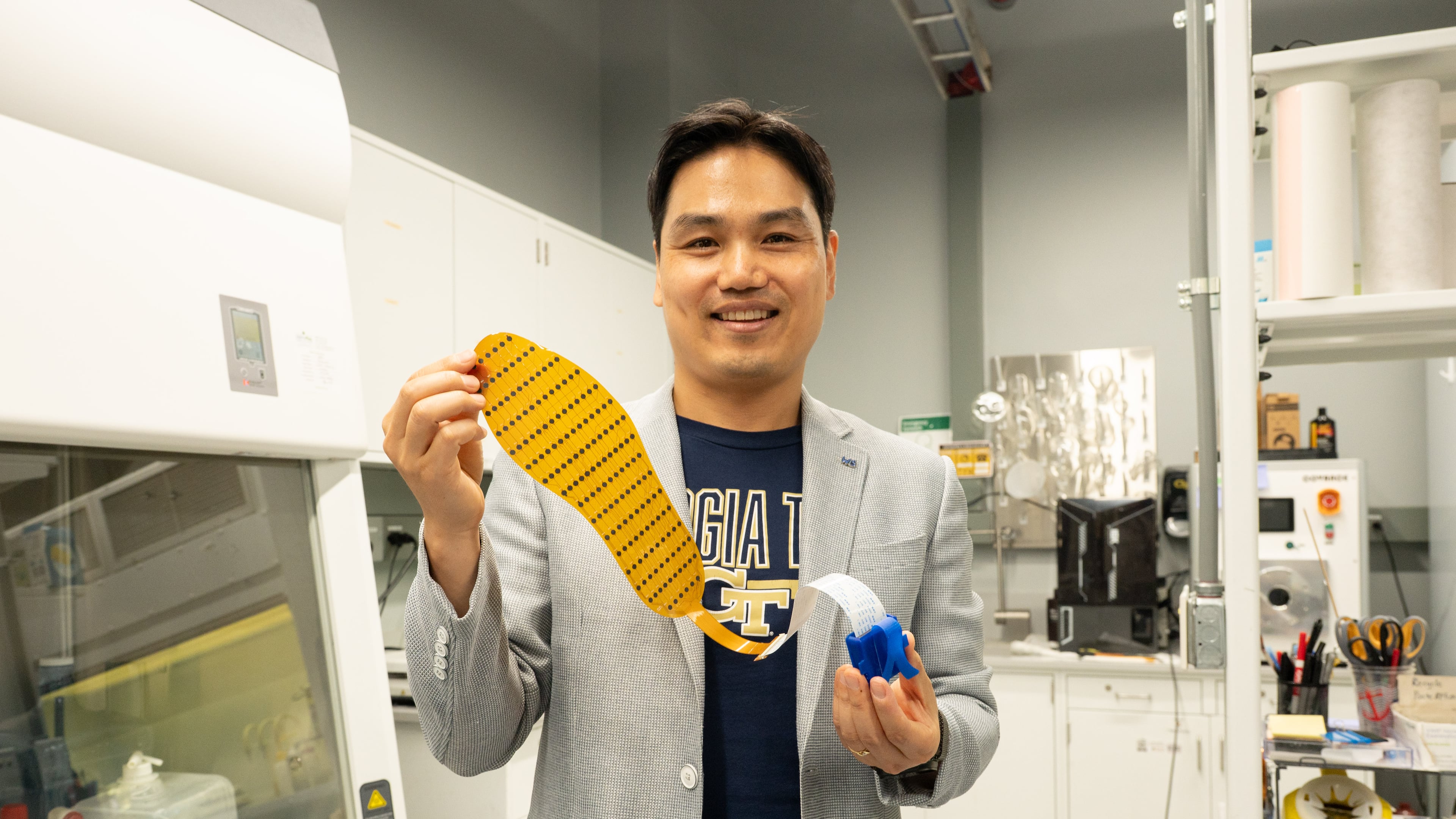 Lead researcher Hong Yeo holds up the 3D-printed shoe insert, which is designed to better monitor foot placement. (Courtesy Georgia Tech)