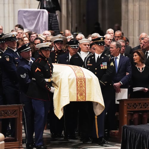 Former Presidents front row from left, George W. Bush with Laura Bush and Joe Biden with Jill Biden, look on as military pall bearers arrive with the casket of former Vice President Dick Cheney at the Washington National Cathedral, Thursday, Nov. 20, 2025 in Washington. (AP Photo/Matt Rourke)