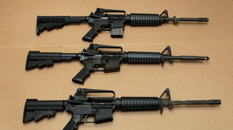 FILE -- In this Aug. 15, 2012 file photo, three variations of the AR-15 assault rifle are displayed at the California Department of Justice in Sacramento, Calif. While the guns look similar, the bottom version is illegal in California because of its quick reload capabilities. Omar Mateen used an AR-15 that he purchased legally when he killed 49 people in an Orlando nightclub over the weekend President Barack Obama and other gun control advocates have repeatedly called for reinstating a federal ban on semi-automatic assault weapons that expired in 2004, but have been thwarted by Republicans in Congress. (AP Photo/Rich Pedroncelli,file)