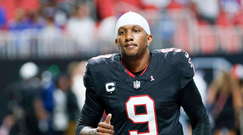 Atlanta Falcons quarterback Michael Penix Jr. is nursing a bone bruise in his left knee but says he is 'feeling good' and preparing to play on Sunday against the Miami Dolphins. (Miguel Martinez/AJC)