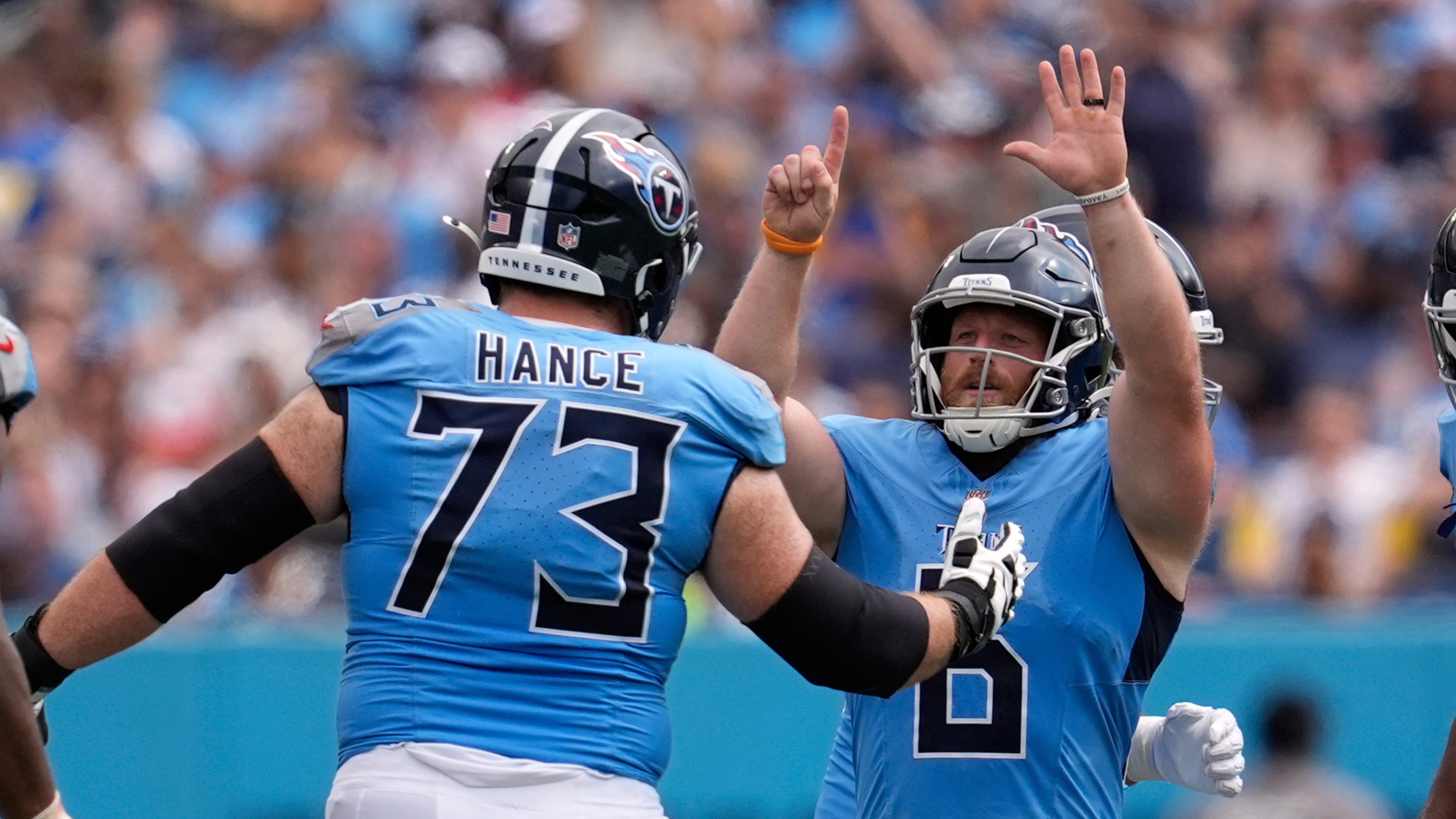 Tennessee Titans place kicker Joey Slye, right, celebrates a field goal with guard Blake Hance during the second half of an NFL football game against the Los Angeles Rams, Sunday, Sept. 14, 2025, in Nashville, Tenn. (AP Photo/George Walker IV)