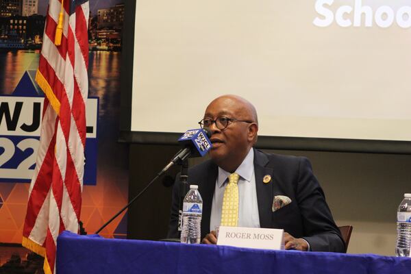 School board president candidate Roger Moss speaks at a recent forum.