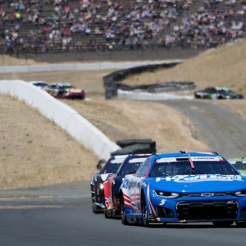 Kyle Larson, foreground, drives in front of cars during a NASCAR Cup Series auto race at Sonoma Raceway, Sunday, June 28, 2026, in Sonoma, Calif. (AP Photo/Jeff Chiu)