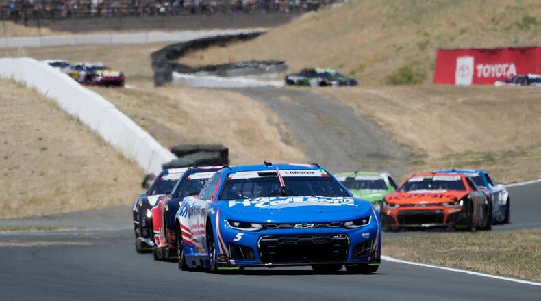 Kyle Larson, foreground, drives in front of cars during a NASCAR Cup Series auto race at Sonoma Raceway, Sunday, June 28, 2026, in Sonoma, Calif. (AP Photo/Jeff Chiu)