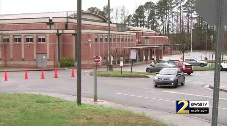 A Sandy Springs middle school physical education teacher resigned after he accidentally showed pornographic images on his personal computer to sixth graders.