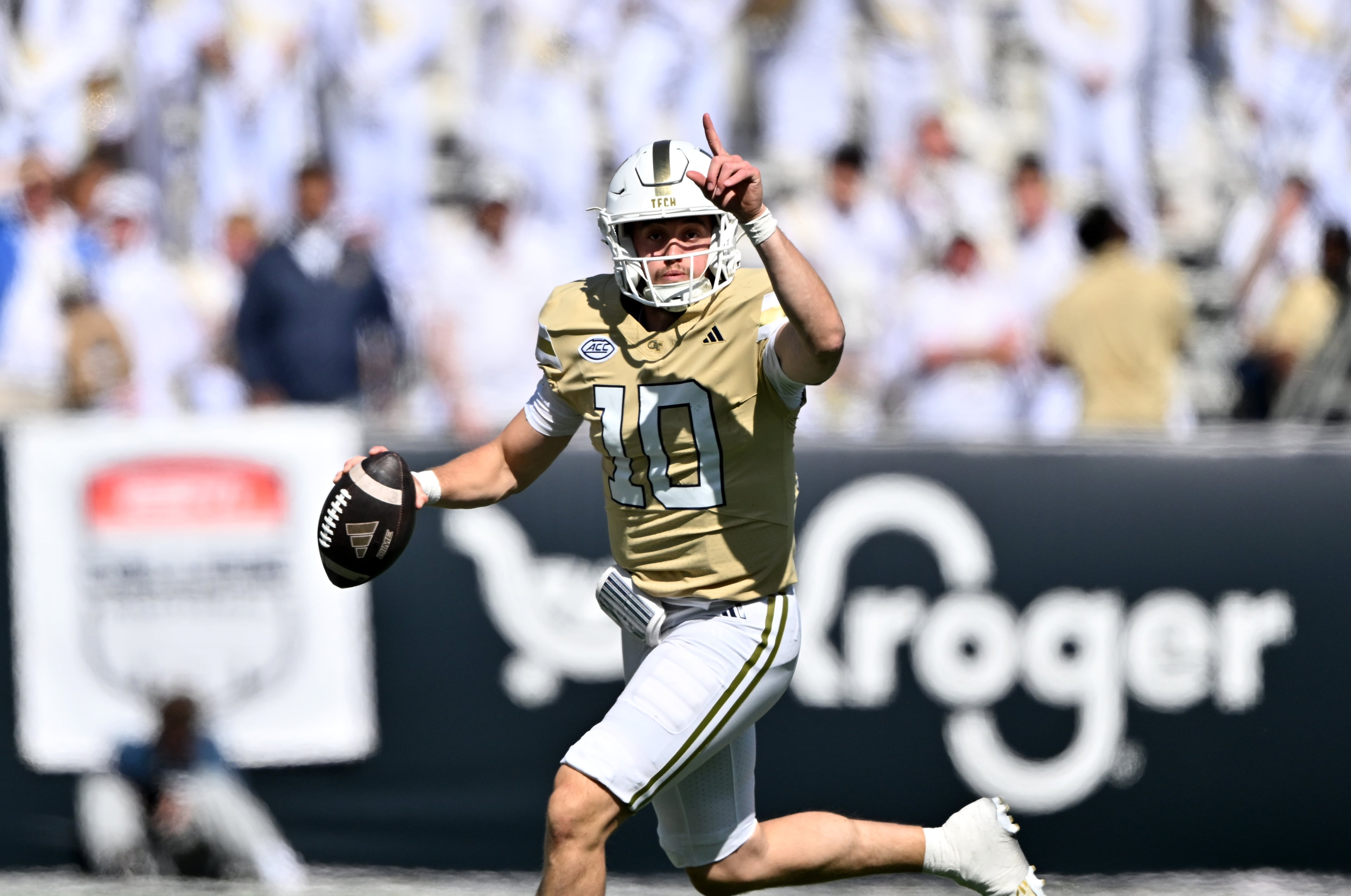 Georgia Tech quarterback Haynes King (10) runs the ball against Syracuse defensive back Braheem Long Jr. (0) during the first half of an NCAA college football game at Bobby Dodd Stadium, Saturday, October 25, 2025 in Atlanta. (Hyosub Shin / AJC)