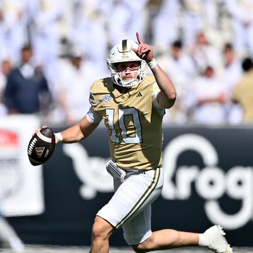 Georgia Tech quarterback Haynes King (10) runs the ball against Syracuse defensive back Braheem Long Jr. (0) during the first half of an NCAA college football game at Bobby Dodd Stadium, Saturday, October 25, 2025 in Atlanta. (Hyosub Shin / AJC)