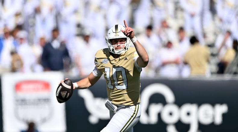 Georgia Tech quarterback Haynes King (10) runs the ball against Syracuse defensive back Braheem Long Jr. (0) during the first half of an NCAA college football game at Bobby Dodd Stadium, Saturday, October 25, 2025 in Atlanta. (Hyosub Shin/AJC)