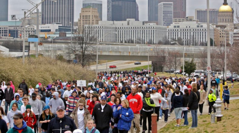 The skyline is visible as the walkers are near the end their walk near Turner Field after looping downtown. The 26th annual hunger walk in downtown Atlanta. More than 10,000 participants were expected to gather at Turner Field to run and walk the 5K route through Downtown Atlanta. Hunger Walk/Run benefits the Atlanta Community Food Bank and five other local nonprofits with hunger relief programs.