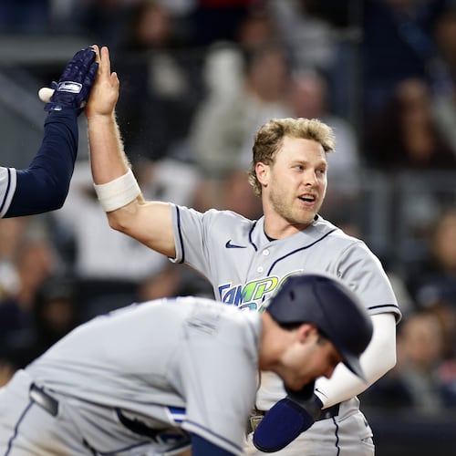 Tampa Bay Rays' Taylor Walls celebrates scoring with Ryan Vilade (26) in the seventh inning during the second baseball game of a doubleheader against the New York Yankees, Tuesday, Sept. 22, 2026, in New York. (AP Photo/Adam Hunger)