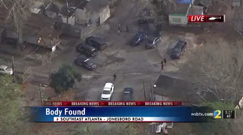 A man found dead behind a southeast Atlanta trailer park Wednesday afternoon was shot in the face and wrapped in a blanket, police said.