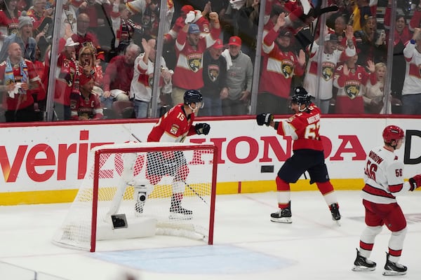 Florida Panthers center Brad Marchand (63) reacts after scoring a goal against the Carolina Hurricanes during the third period in Game 3 of the NHL hockey Stanley Cup Eastern Conference finals Saturday, May 24, 2025, in Sunrise, Fla. (AP Photo/Lynne Sladky)