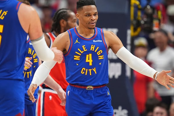 Denver Nuggets guard Russell Westbrook is congratulated after drawing a foul against the Los Angeles Clippers in the second half of Game 7 of an NBA basketball first-round playoff series Saturday, May 3, 2025, in Denver. (AP Photo/David Zalubowski)