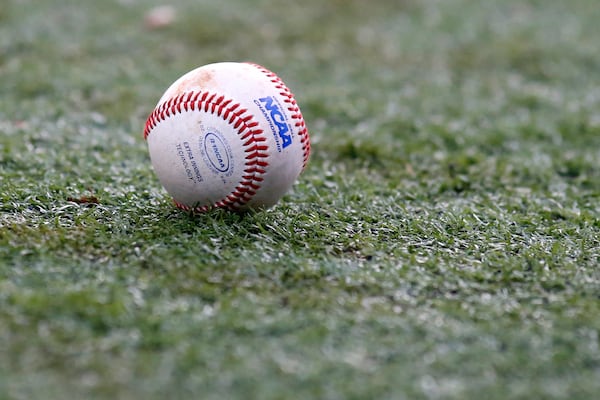 FILE - The NCAA logo is seen on a baseball during an NCAA college baseball tournament regional game between Louisiana-Lafayette and Mississippi State in Lafayette, La., Monday, June 2, 2014. (AP Photo/Jonathan Bachman, file)