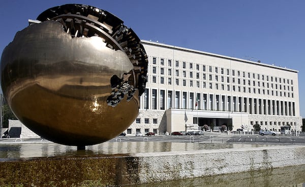 FILE-- A spherical bronze sculpture by Italian artist Arnaldo Pomodoro, is seen outside the Italian Foreign Ministry Farnesina building, in Rome, Saturday, July 22, 2006. (AP Photo/Plinio Lepri)