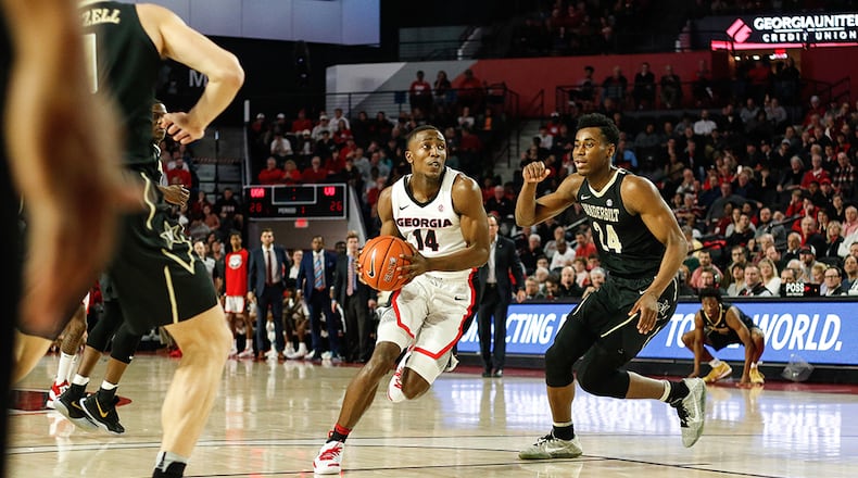 Georgia guard Tye Fagan (14) drives the ball against Vanderbilt last January at Stegeman Coliseum. Fagan, now a junior, is one of just five returning lettermen for the Bulldogs, and the only one to have played all three seasons with coach Tom Crean.