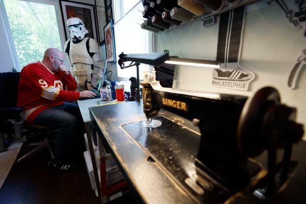 Huckleberry Starnes works on his next project inside his Huckamade studio on Monday, April 27, 2026, in Decatur. Starnes learned how to use his vintage sewing machines with the help of a tutor from craft website Etsy. (Miguel Martinez/AJC)