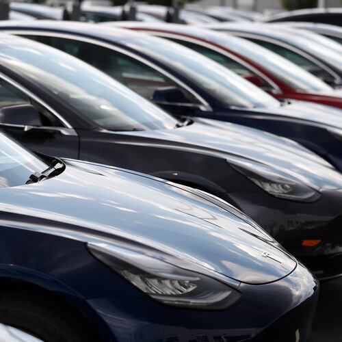 FILE - Several 2018 Model 3 sedans sit on display outside a Tesla showroom, July 8, 2018, in Littleton, Colo. (AP Photo/David Zalubowski, File)