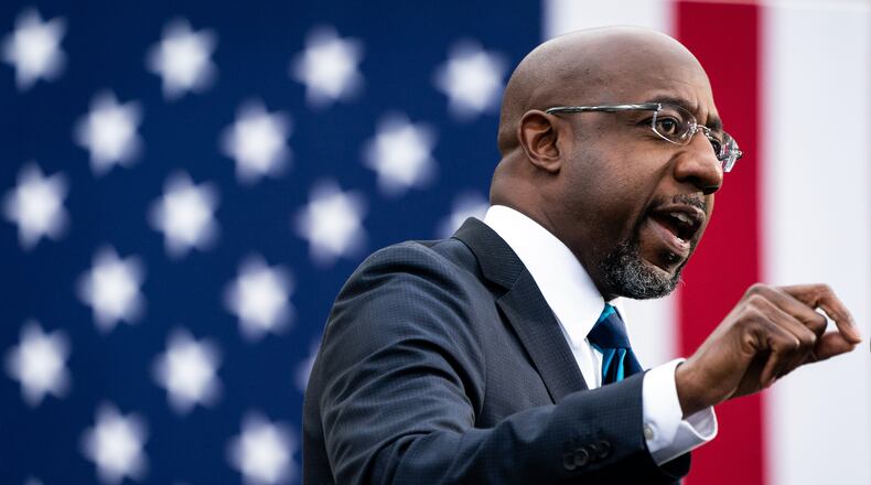 FILE — The Rev. Raphael Warnock speaks at a rally in Atlanta during his successful campaign for a U.S. Senate seat on Dec. 15, 2020. The stark stylistic differences between the polished Warnock, a Democrat, and his less politically refined Republican challenger, Herschel Walker, the former University of Georgia football great, add unpredictability and intrigue to a highly anticipated debate on Friday night, Oct. 14, 2022. (Erin Schaff/The New York Times)