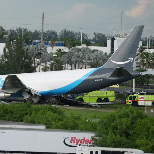 An Amazon cargo plane sits at the Miami International Airport (MIA) after it overshot the runway, Sunday, Sept. 6, 2026. (AP Photo/Lynne Sladky)