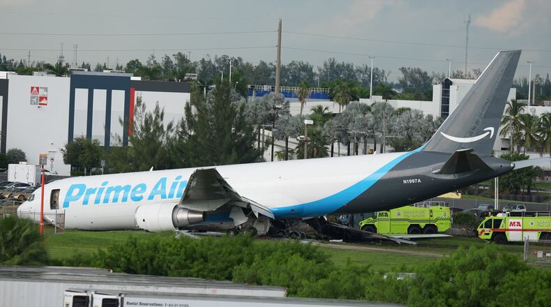 An Amazon cargo plane sits at the Miami International Airport (MIA) after it overshot the runway, Sunday, Sept. 6, 2026. (AP Photo/Lynne Sladky)