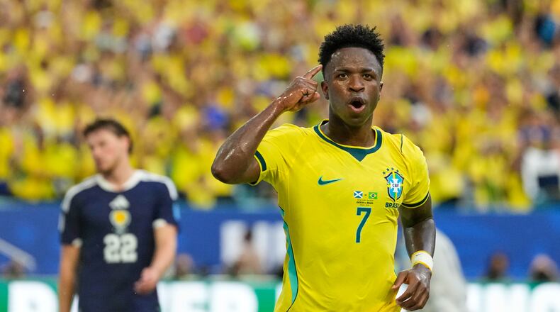 Brazil's Vinicius Junior (7) celebrates after scoring his side's second goal during the World Cup Group C soccer match between Scotland and Brazil in Miami Gardens, Fla., Wednesday, June 24, 2026. (AP Photo/Rebecca Blackwell)