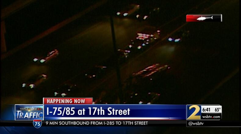 A crash on the Downtown Connector, one of three, was moved off to the side of the interstate Friday at 17th Street. (Credit: Channel 2 Action News)