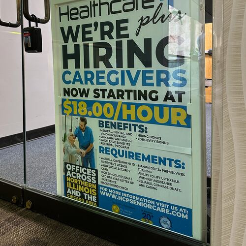 Hiring sign is displayed at a office in Schaumburg, Ill., Tuesday, Jan. 5, 2026. (AP Photo/Nam Y. Huh)