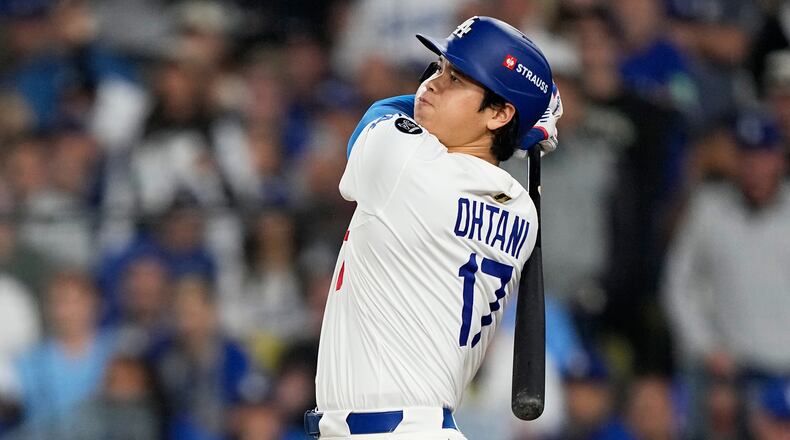 FILE - Los Angeles Dodgers' Shohei Ohtani watches his home run against the Toronto Blue Jays during the seventh inning in Game 3 of baseball's World Series, Monday, Oct. 27, 2025, in Los Angeles. (AP Photo/Brynn Anderson, File)