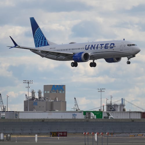 A plane lands at Newark International Airport in Newark, N.J., Thursday, Nov. 6, 2025. (AP Photo/Seth Wenig)