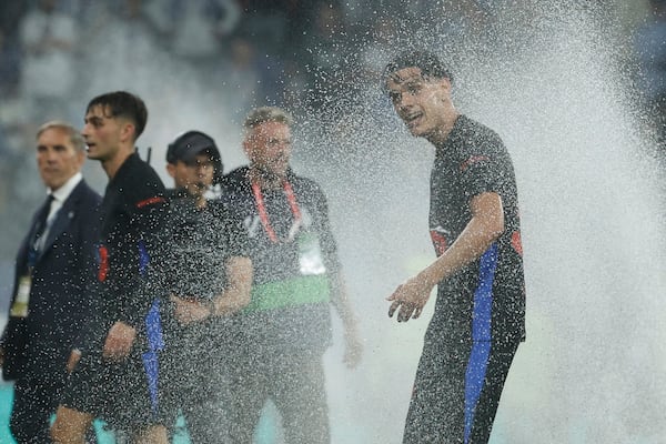 Barcelona's Hector Fort celebrates at the end of the Spanish La Liga soccer match between Barcelona and Espanyol at Lluis Companys Olympic Stadium in Barcelona, Spain, Thursday, May 15, 2025. (AP Photo/Joan Monfort)