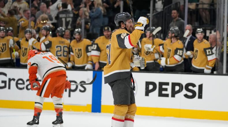 Vegas Golden Knights right wing Mark Stone (61) celebrates after a goal by Vegas Golden Knights right wing Mitch Marner during the third period of Game 1 of a second-round NHL hockey Stanley Cup playoff series Monday, May 4, 2026, in Las Vegas. (AP Photo/John Locher)