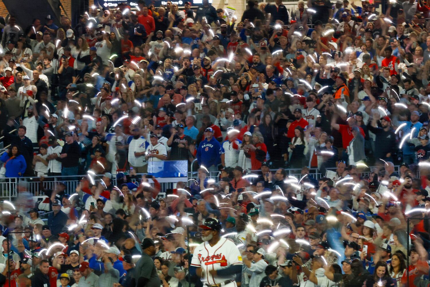 Fans wave lights during the seventh inning of NLDS Game 2 in Atlanta on Monday, Oct. 9, 2023.   (Miguel Martinez / Miguel.Martinezjimenez@ajc.com)