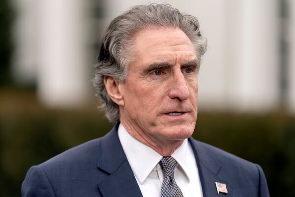 FILE - Interior Secretary Doug Burgum speaks with a reporter outside the West Wing of the White House, Thursday, April 10, 2025, in Washington. (AP Photo/Mark Schiefelbein, FIle)