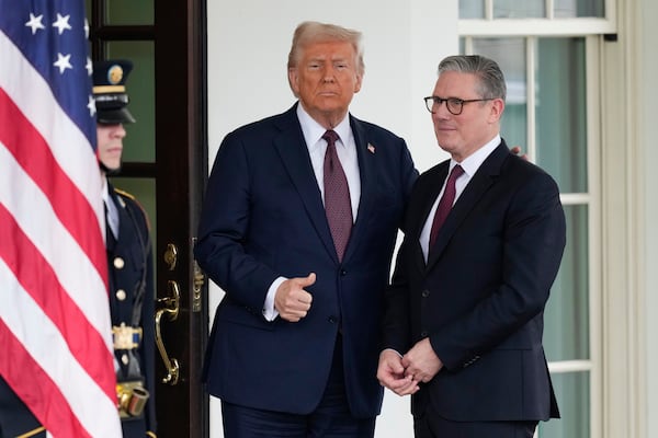 Britain's Prime Minister Keir Starmer, right, is greeted by President Donald Trump as he arrives at the White House in Washington, Thursday, Feb. 27, 2025. (AP Photo/Ben Curtis)
