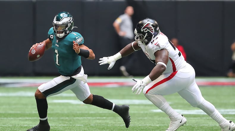 Falcons defensive lineman Grady Jarrett runs Philadelphia Eagles quarterback Jalen Hurts out of bounds on a 4th-and-4 attempt to turn it over on downs during the second quarter Sunday, Sept. 12, 2021, at Mercedes-Benz Stadium in Atlanta. (Curtis Compton / Curtis.Compton@ajc.com)