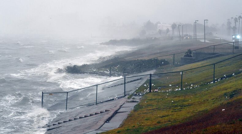 Strong winds batter seaside houses before the approaching Hurricane Harvey in Corpus Christi, Texas. (MARK RALSTON/AFP/Getty Images)