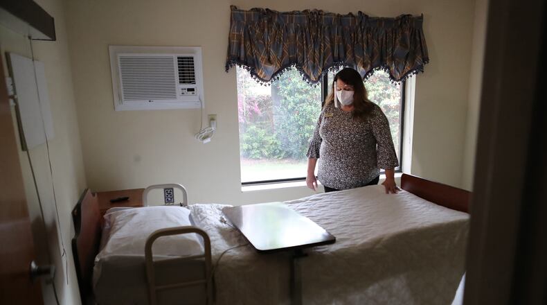 033021 Jackson: Administrator Jennifer Vasil, RN, looks over a bed in an empty room on the hallway where residents with Covid used to be and have since died at Westbury Medical Care and Rehab on Tuesday, March 30, 2021, in Jackson.  “Curtis Compton / Curtis.Compton@ajc.com”