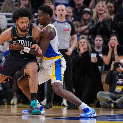 Detroit Pistons guard Cade Cunningham (2) drives on Indiana Pacers guard Bennedict Mathurin (00) during the second half of an NBA basketball game in Indianapolis, Monday, Nov. 24, 2025. (AP Photo/Michael Conroy)