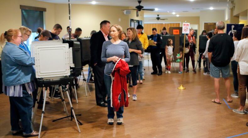 A steady steam of people vote at the St Mary's Orthodox Church in Roswell, Ga., Tuesday, Nov. 6, 2018. (Bob Andres/Atlanta Journal-Constitution via AP)